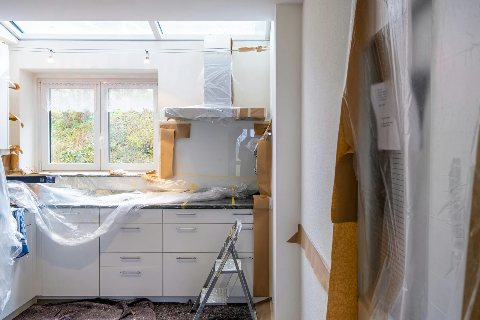 A bright kitchen protected for maintenance and painting